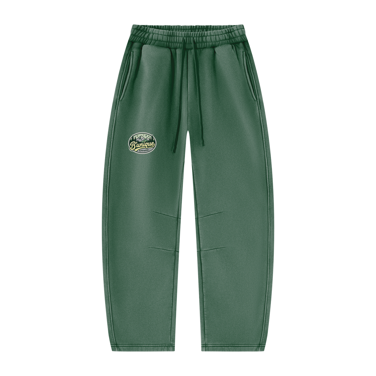 ODMPOD Unisex UNIQUE MOUNTAIN Vintage Wash sweatpants in dark green, featuring an elastic waistband, drawstring, and a mountain graphic patch on the upper left leg.
