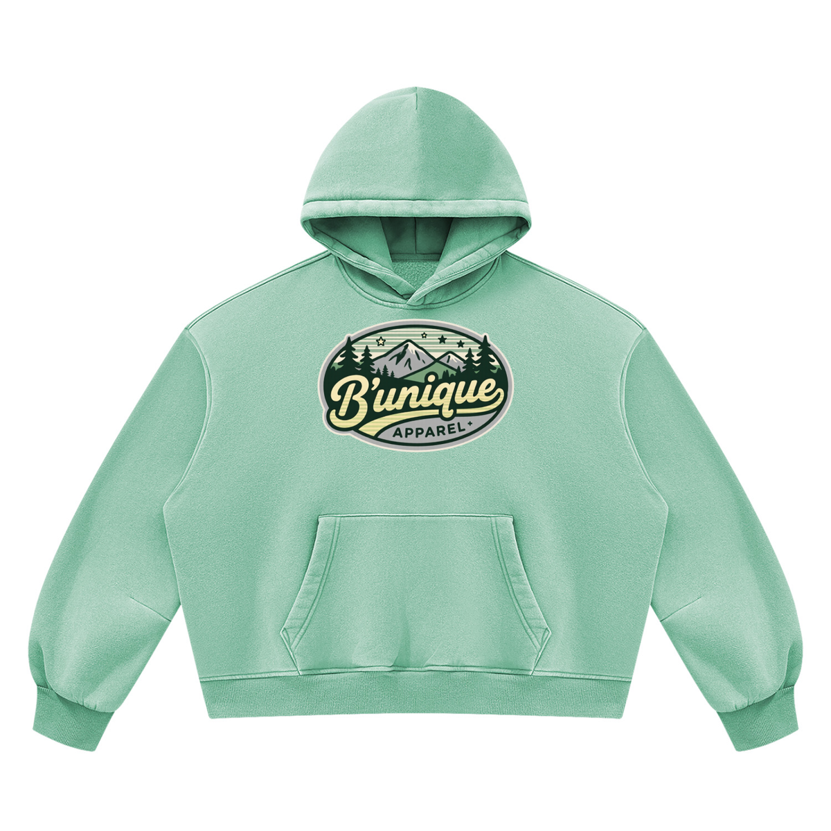 Mint green Unisex UNIQUE MOUTAIN Vintage Wash Boxy Fleece Hoodie featuring an oval graphic on the chest with a mountain illustration and the text Bunique APPAREL.