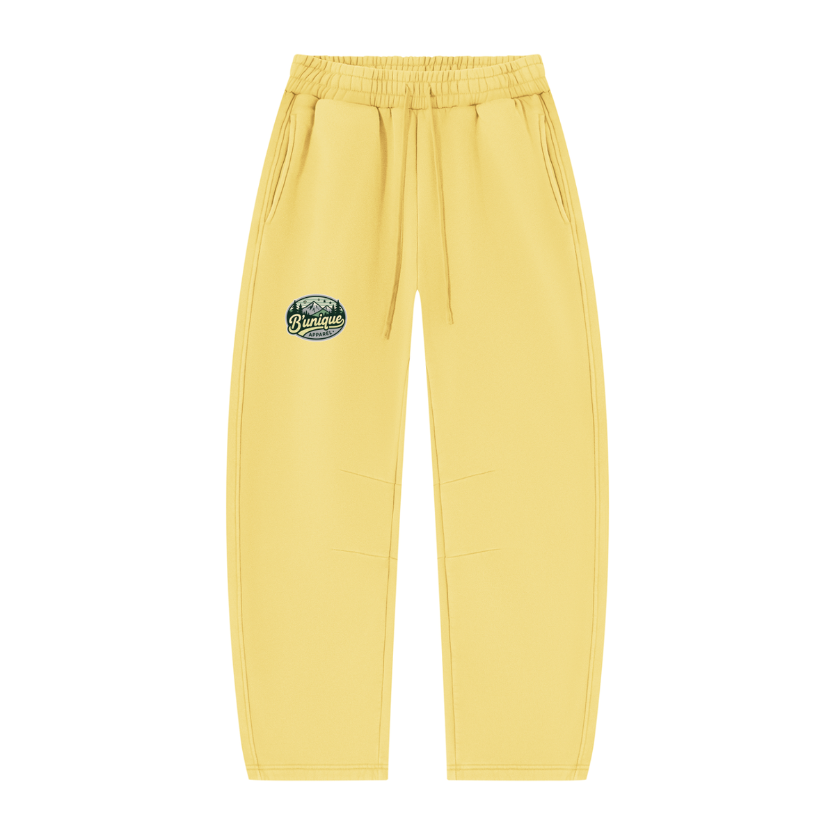 Pale yellow ODMPOD Unisex UNIQUE MOUNTAIN Vintage Wash Sweatpants featuring an elastic drawstring waist and a small circular mountain graphic on the left hip.