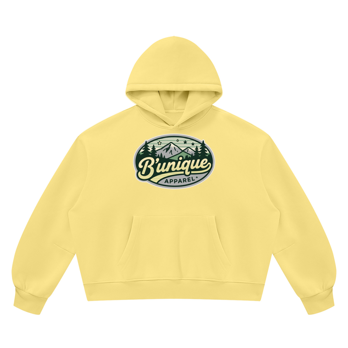 Pale yellow ODMPOD Unisex UNIQUE MOUTAIN Vintage Wash Boxy Fleece Hoodie with a kangaroo pocket and a chest graphic of mountains, pine trees, stars, and the text Bunique APPAREL.
